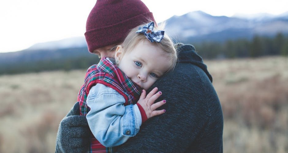 divorcing with kids Parent holding child - divorcing with kids