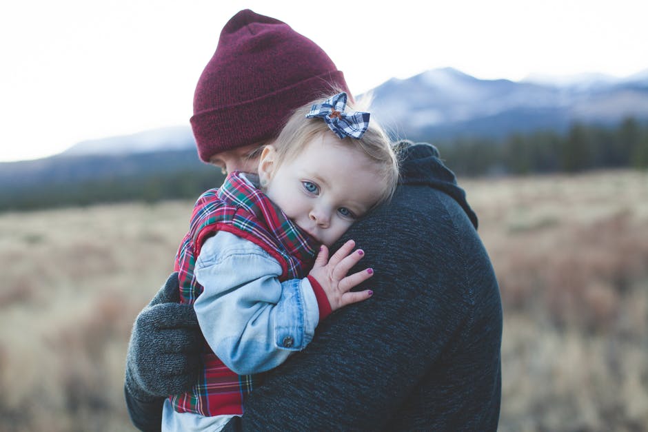 Parent holding child - divorcing with kids